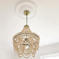 photo showing Floral Plaster Ceiling Rose 500mm in light and airy room with beaded chandelier.