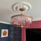 victorian ornate plaster ceiling rose in colourful room