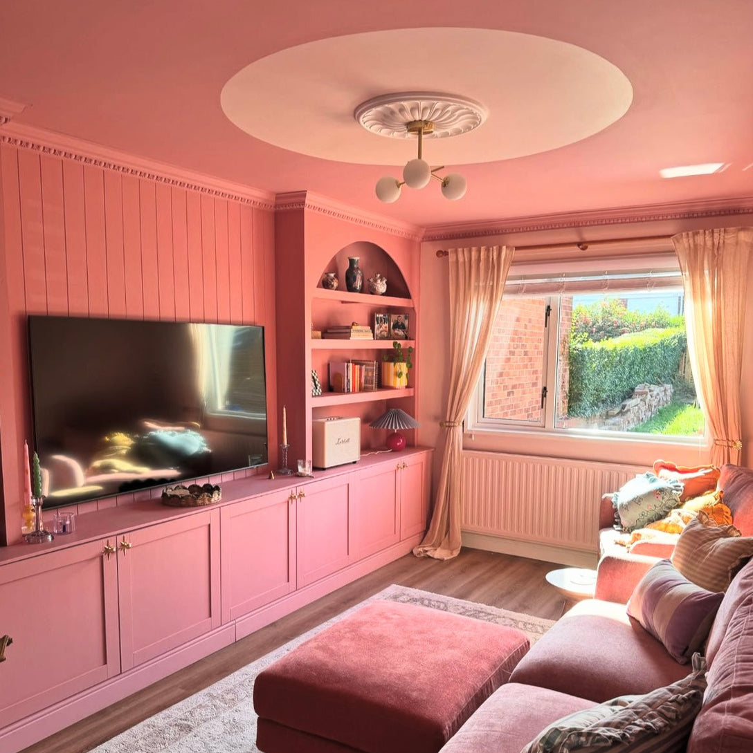 Art Deco plaster ceiling rose in pink painted room