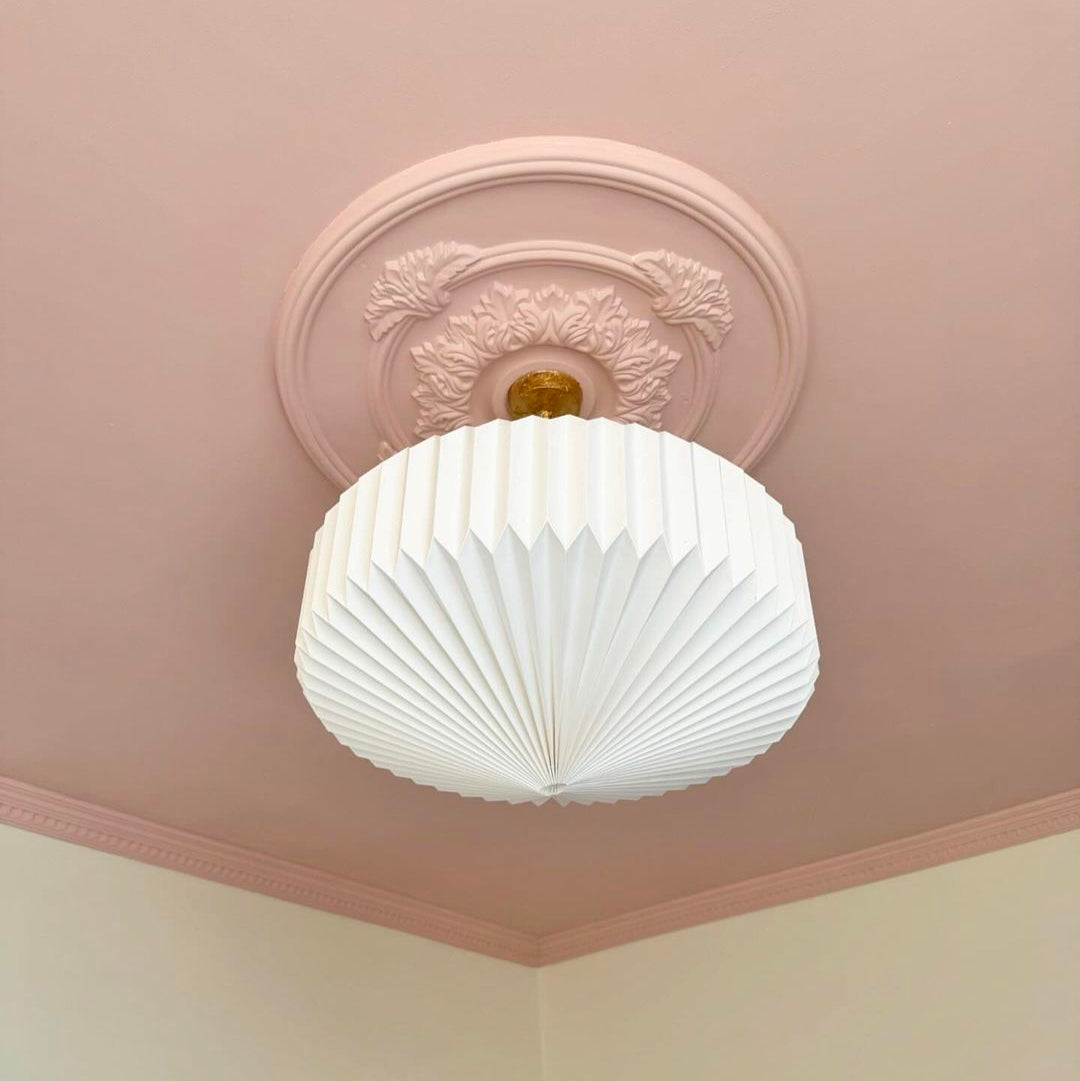 Victorian plaster ceiling rose painted in pink